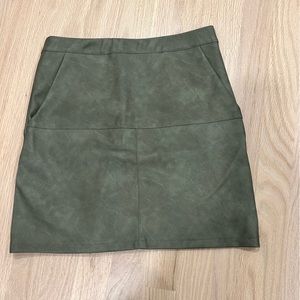 Small green leather mini skirt